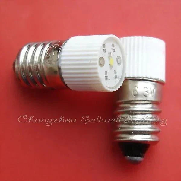 6.3V E10 LED lamp with white base and green light components on red background