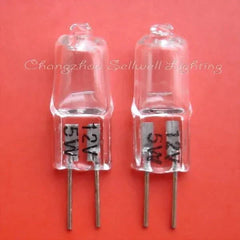 Set of two 12v 5w G4 halogen bulbs with metal pins on red background