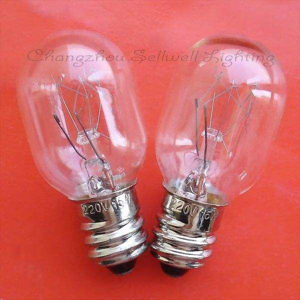 Two clear E12 instrument bulbs with metal screw bases marked 220V on red background