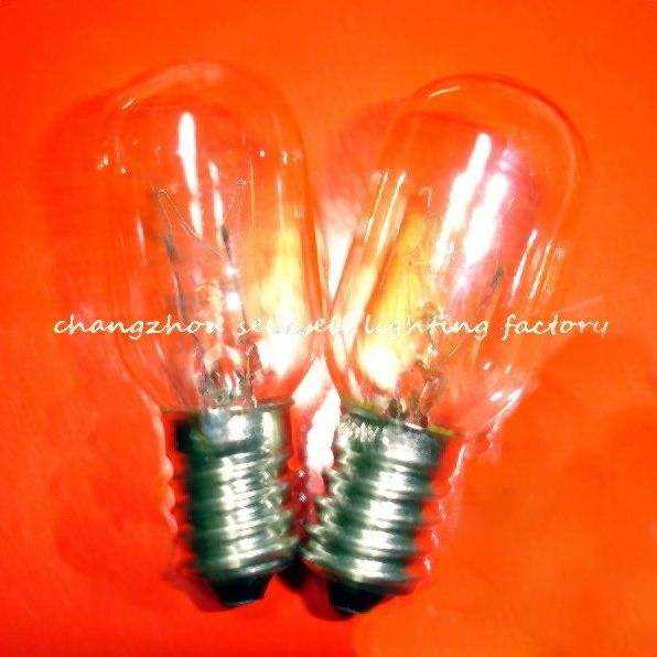 Two E14 transparent spiral old screw indicator bulbs on orange background