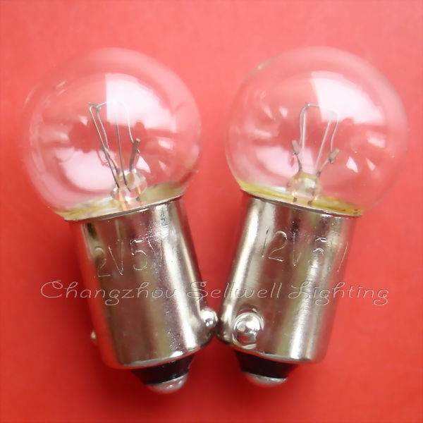 pair of Ba9s lamp holders with clear signal light bulbs on red background