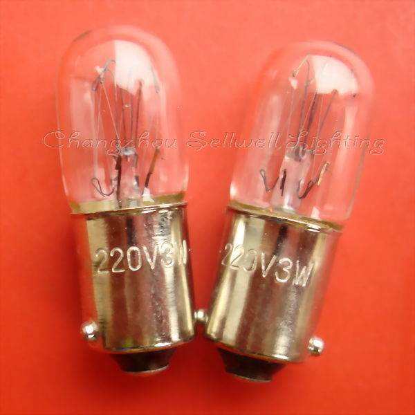 Two Ba9s lamp holders with clear bulbs marked 220V 3W on a red background