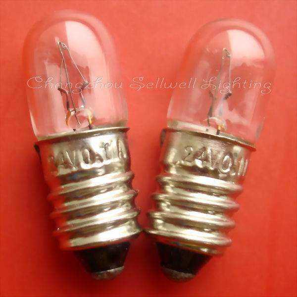 Close-up of two E10 screw instrument bulbs with metal bases on red background