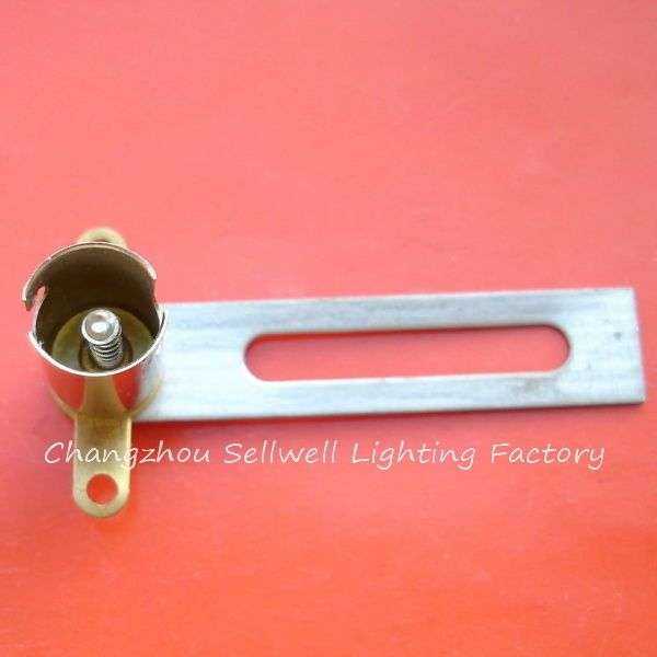 metal lamp holder Ba9s for light bulbs on red background educational signal instrument component