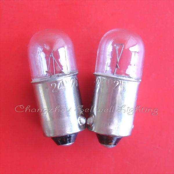 Two clear Ba9s lamp holders with metal bases on red background