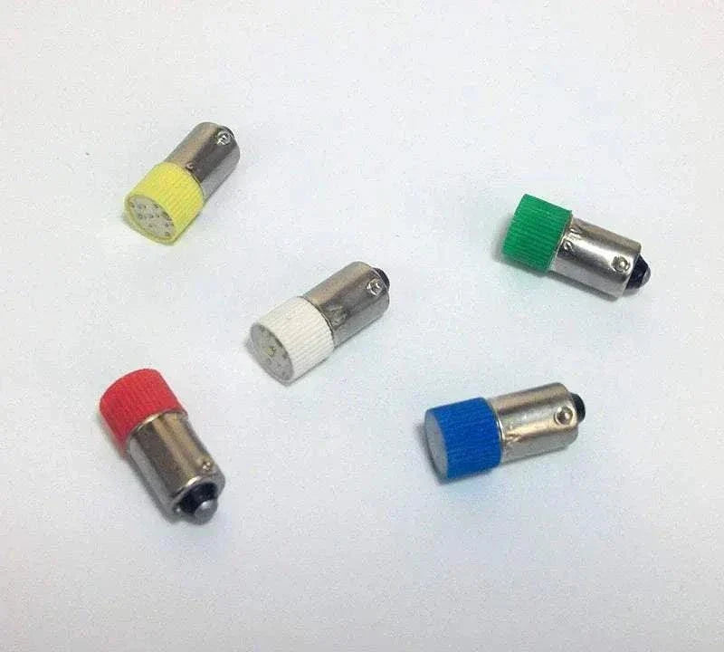 Mini LED BA9S indicator light bulbs with colored caps in red, yellow, white, blue, and green.