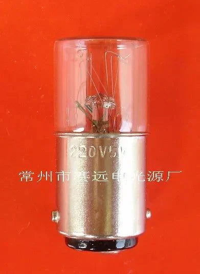 Miniature lamp 220v 5w ba15d A260 clear glass bulb with metallic base on orange background