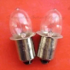 Pair of 2.4V 0.85A P13.5S Krypton light bulbs on red background