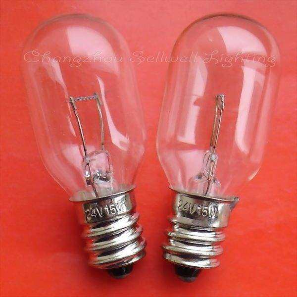 Two clear E12 instrument bulbs with visible filaments and metal screw bases on a red background