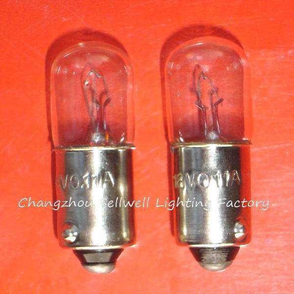 Two clear glass lamp holders Ba9s with metallic bases for teaching and signal instruments on orange background