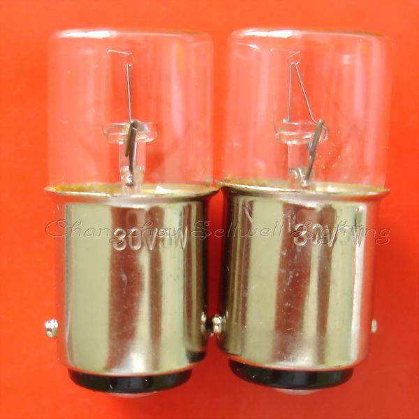 Pair of 30V double-point bayonet lamp holders BA15D miniature light bulbs on red background