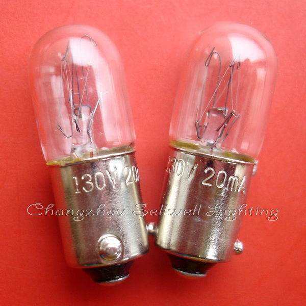 Close-up of two clear Ba9s lamp holders with 130V 20mA markings on red background